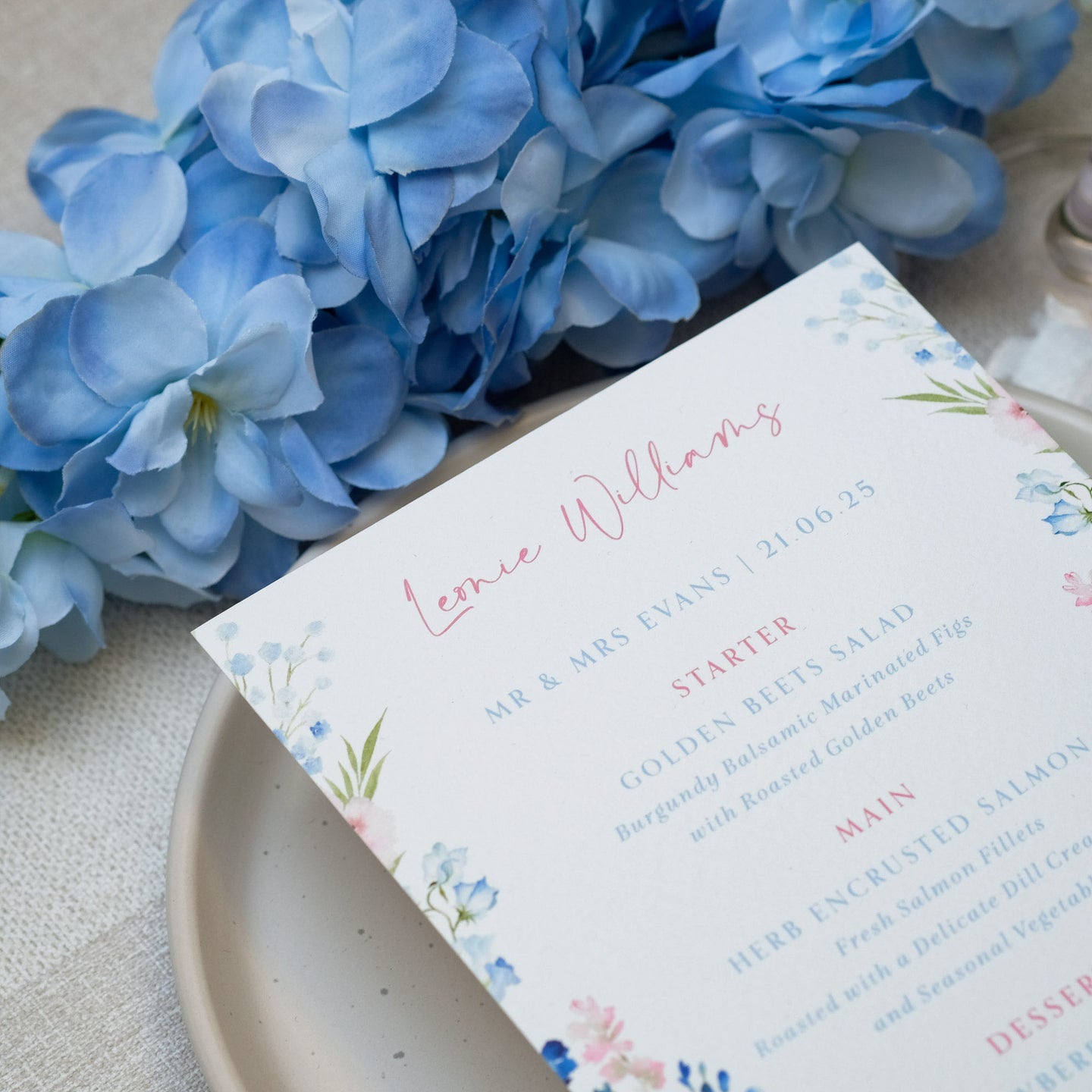Blue floral wildflower wedding menu with guest name